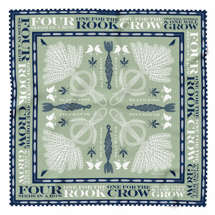 Sage coloured organic silk scarf with navy and white corn dolly print and blue and white hand rolled hem.