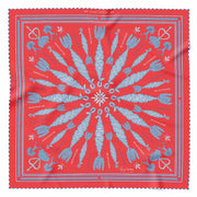Spiral Corn Dolly Pattern Scarf in bright orange with white and navy corn dolly pattern and hand-rolled chequered hem.
