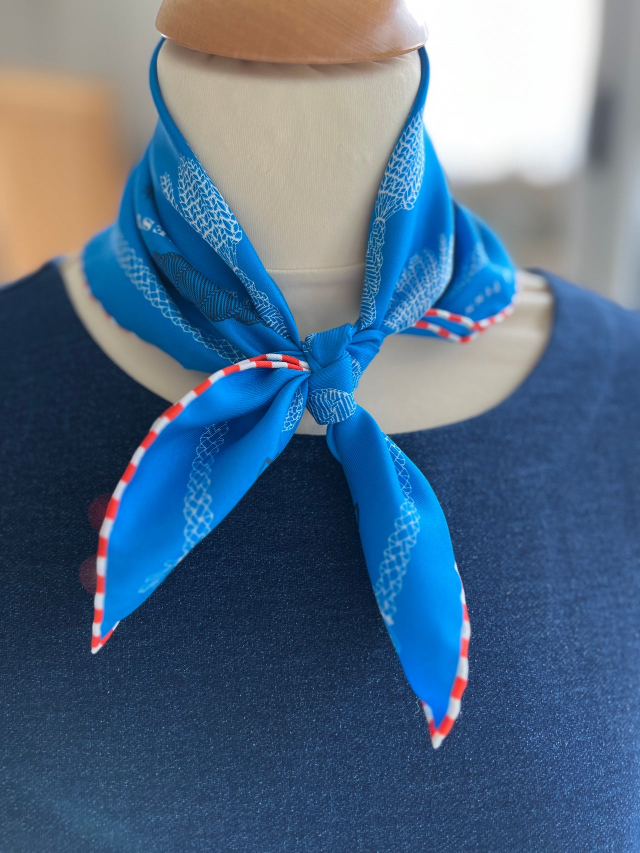 Mordiford Love Heart Corn Dolly Pattern Scarf in blue with white and navy pattern and hand-rolled chequered hem, based on an original corn dolly by Penny Maltby.
